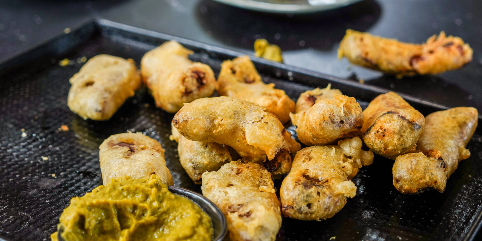 Deep fried ribs with jalapeno apple dip