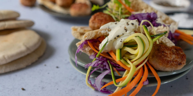 Pork Sausage Meatball Pitas with Shredded Vegetables