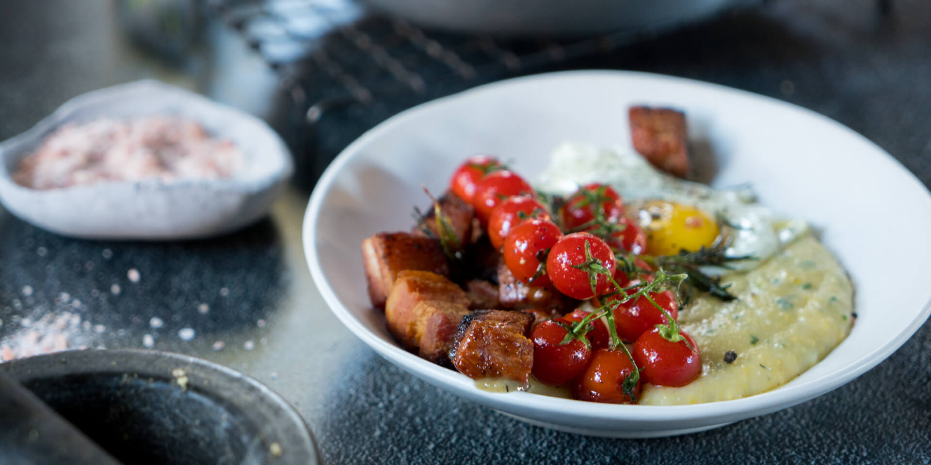 Creamy Herb Polenta with Crispy Bacon, Cherry Tomatoes & Fried Eggs