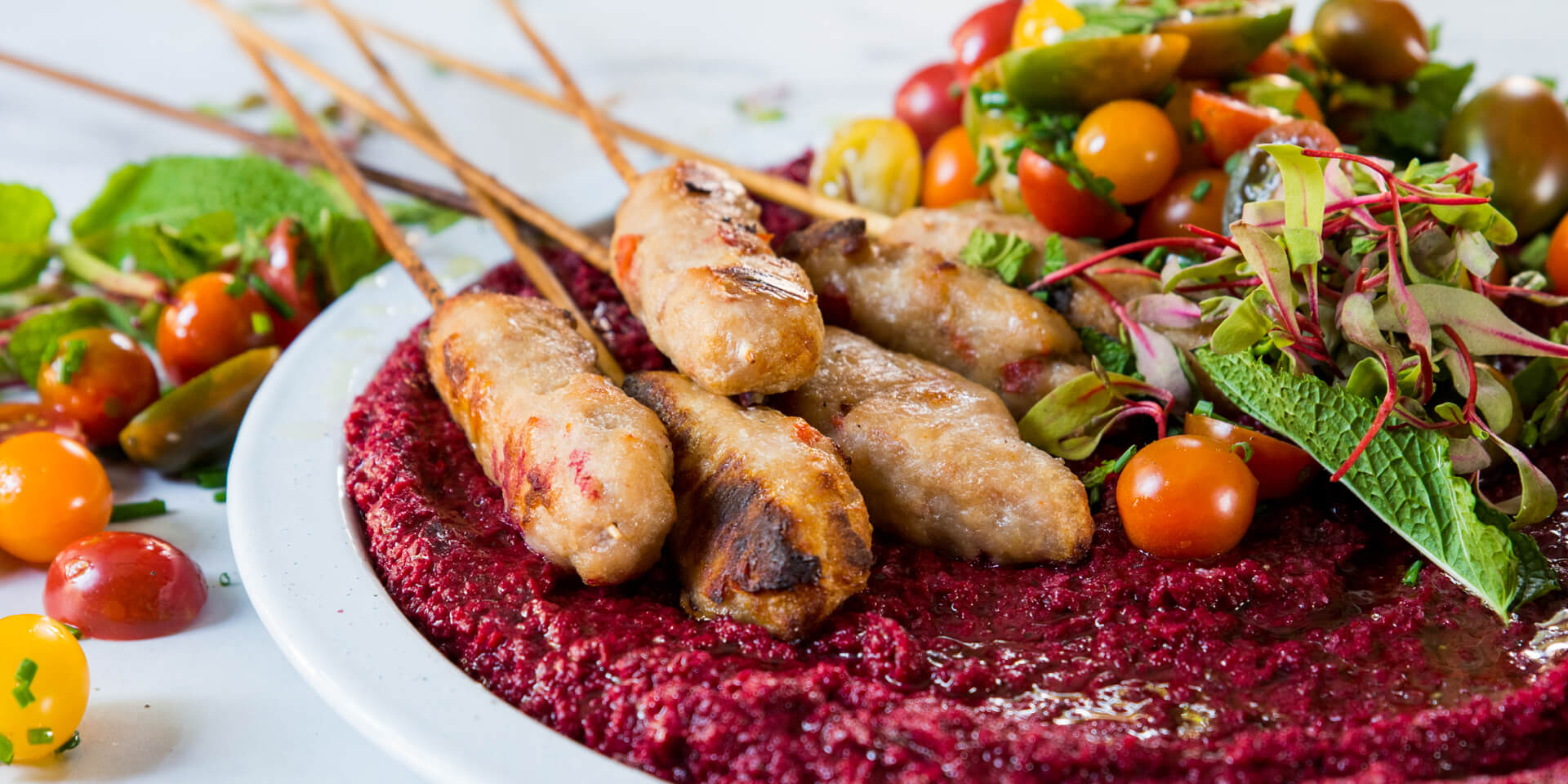 Peppadew® Pork Kofta with a Beetroot Hummus and a Tomato Salsa.