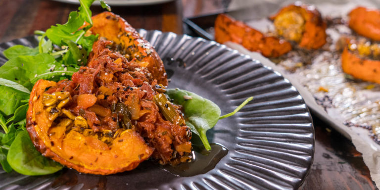 Roasted Pumpkin with Pork Ragu, Mixed Seeds and Salad Greens