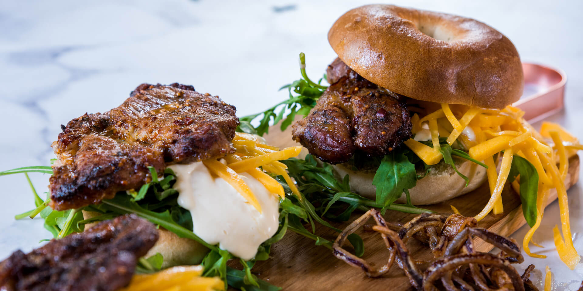 Prego Steak Bagel with a Butternut Pickle and Deep-Fried Red Onions